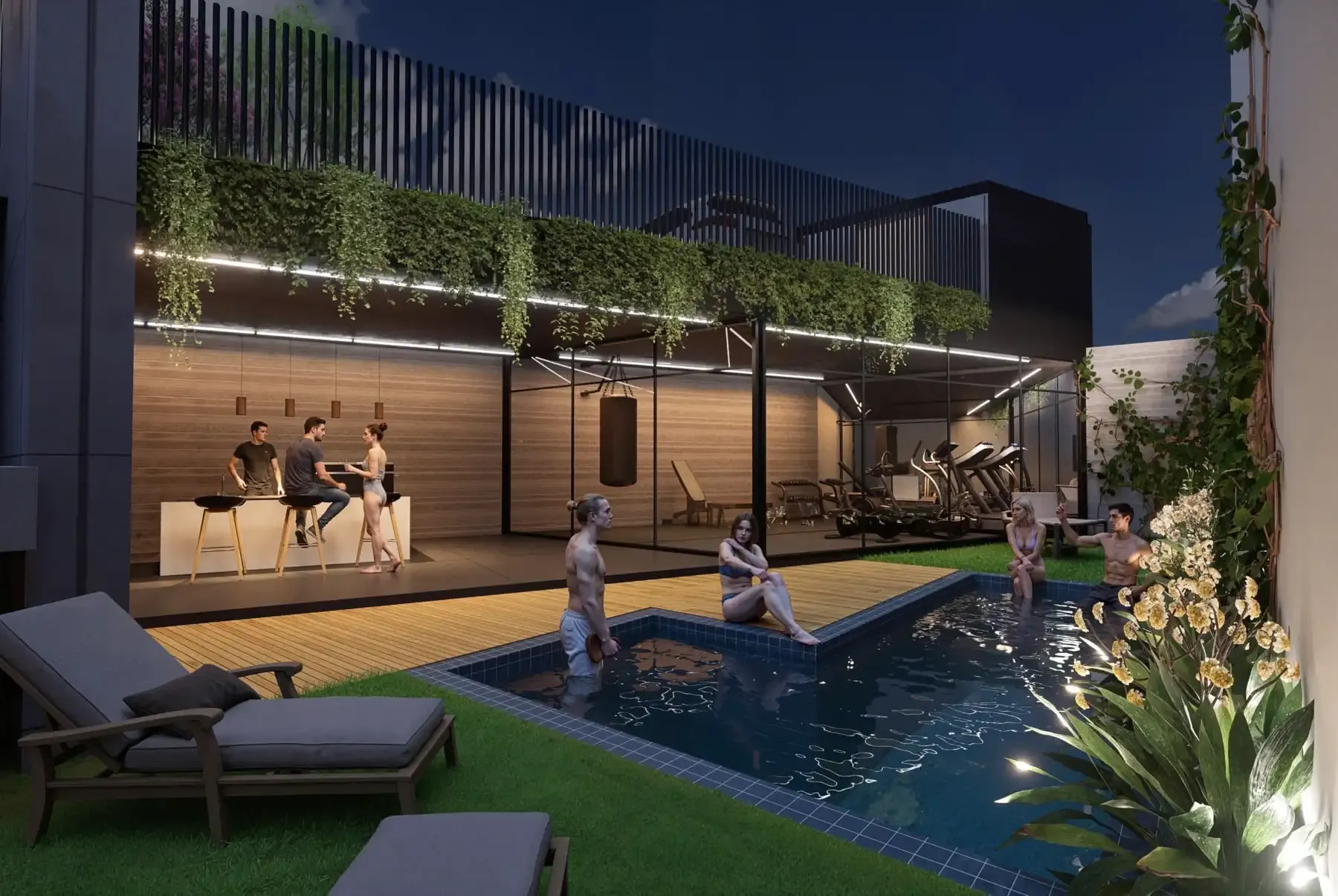 Piscina del conjunto al atardecer, con deck de madera, tumbonas y muro verde.